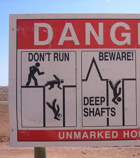A sign board warning about deep shafts in Coober Pedy