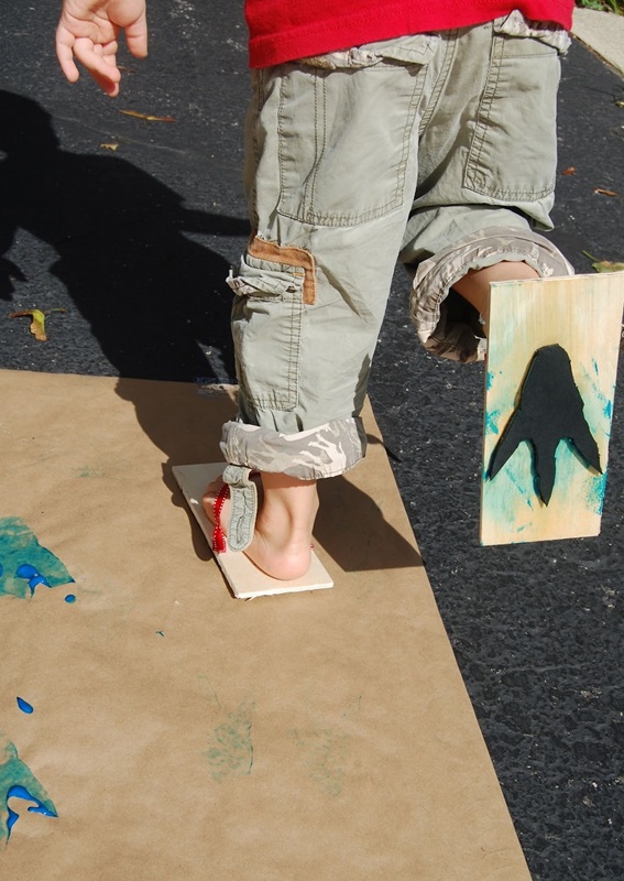 9. Make dinosaur footprints with flip flops