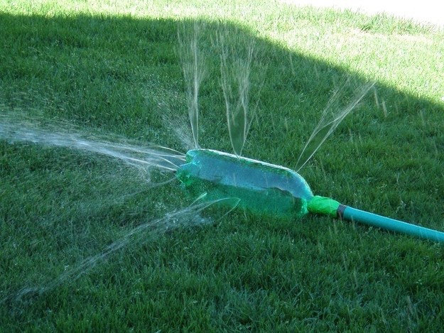  Put a two-liter bottle at the end of a garden hose, make several holes in it and turn on the water for fun