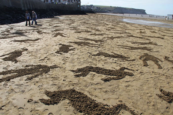 9000 Human Silhouettes Drawn On The Normandy Beaches To Promote World Peace