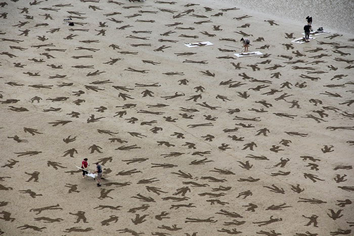9000 Human Silhouettes Drawn On The Normandy Beaches To Promote World Peace