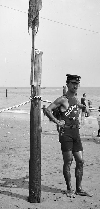 A lifeguard on a beach in the 1920s