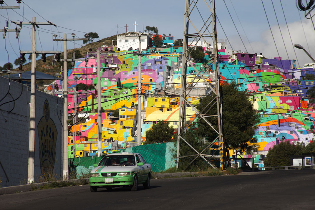 To Unite The Community Against Violence Artists Paint A Mural On 200 Houses -3