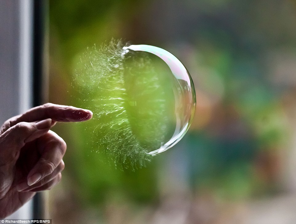 The moment a bubble is burst using finger