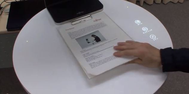 A Futuristic Interface That Turns Everyday Paper Into An Interactive Screen (Video)