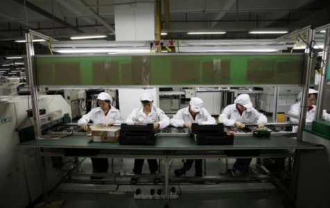 Workers are seen inside a Foxconn factory in the township of Longhua in the southern Guangdong province